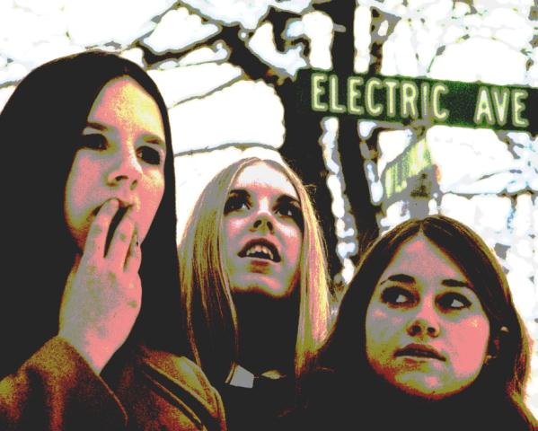 Three girls looking spookily psychedelic on Electric Avenue.